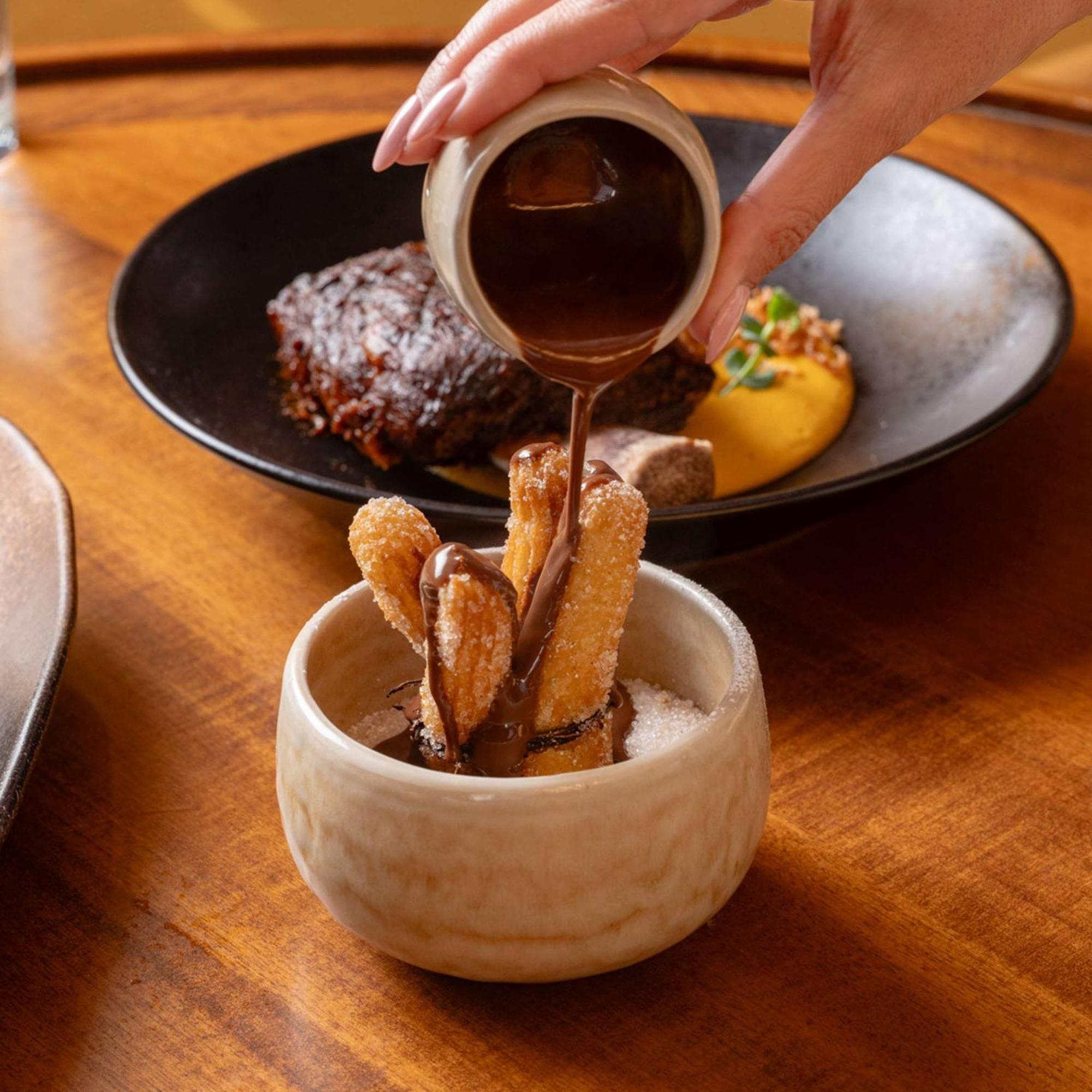 V Hotel Dubai, Curio Collection By Hilton Luaran gambar Soy sauce being poured on tempura